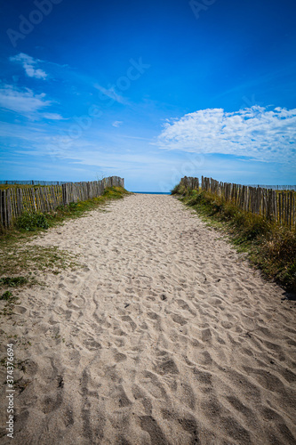 Wooden Fence at a sandy beach in Brittany  France