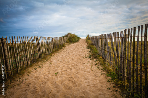 Wooden Fence at a sandy beach in Brittany  France