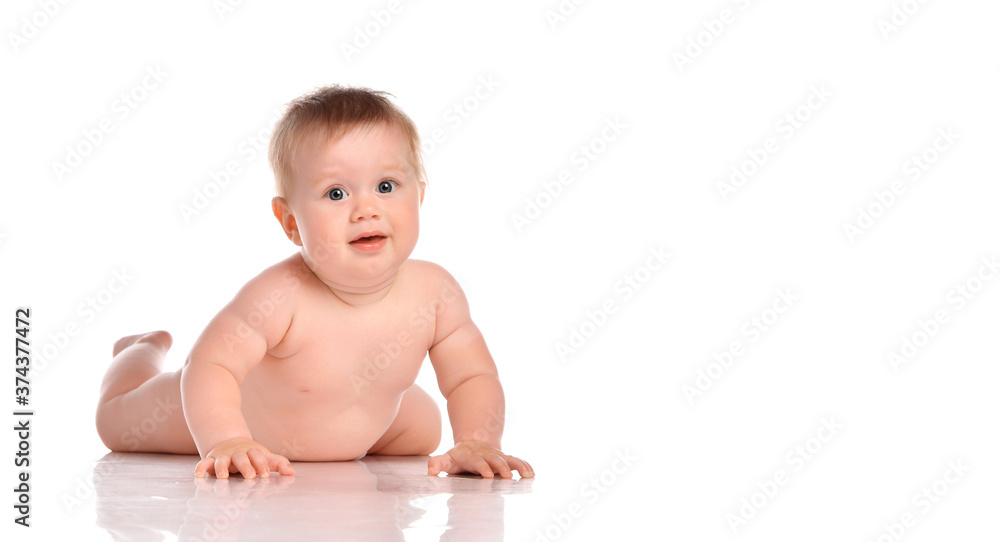 One year old naked baby boy crawls on a white background. One year old naked baby boy crawls on a white background.