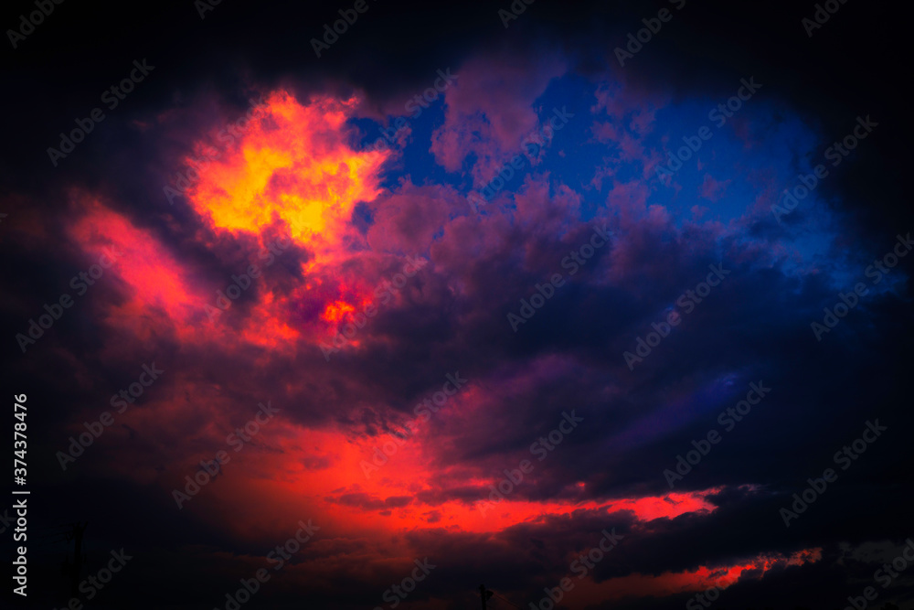 Dramatic Pink, Orange and Blue Cloudscape over the Forest at Twilight