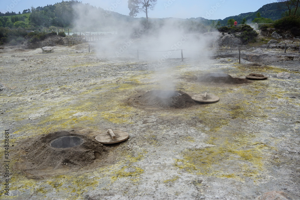 Fototapeta premium alternative cooking in the many smoking geysers at Caldeiras das Furnas, San Miguel Island, Azores, Portugal