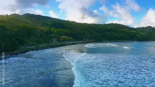 The waves crashing on the shore photo