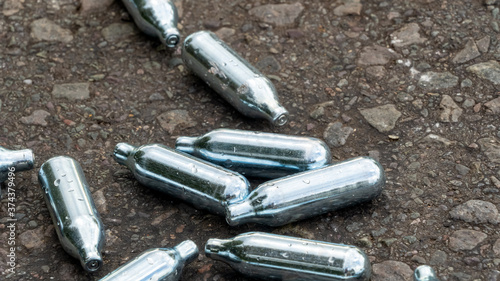 Photos Nitrous Oxide used gas canisters discarded on the roadside