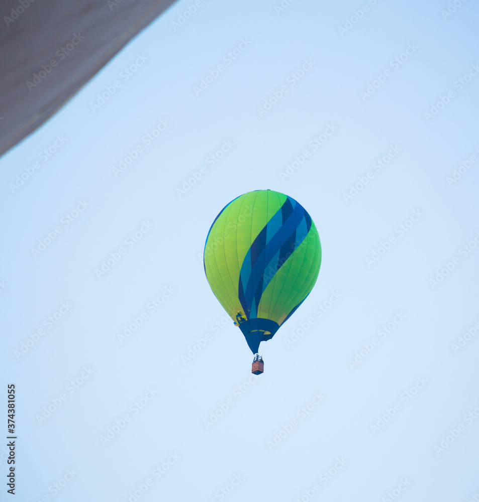 Fototapeta premium Big balloon flies against the sky