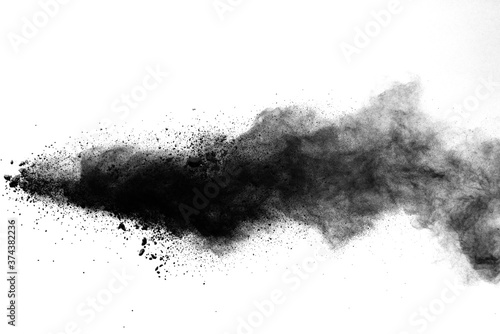 Black powder explosion isolated on white background.