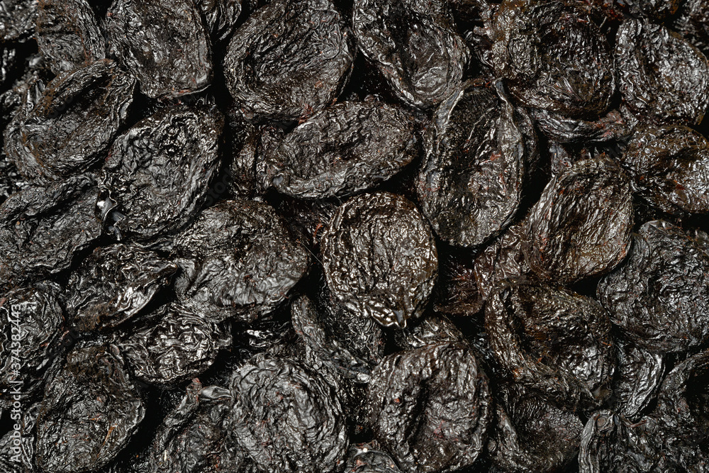 Dried prunes as a spectacular black background from natural products. Dried prunes as a spectacular black background from natural products.