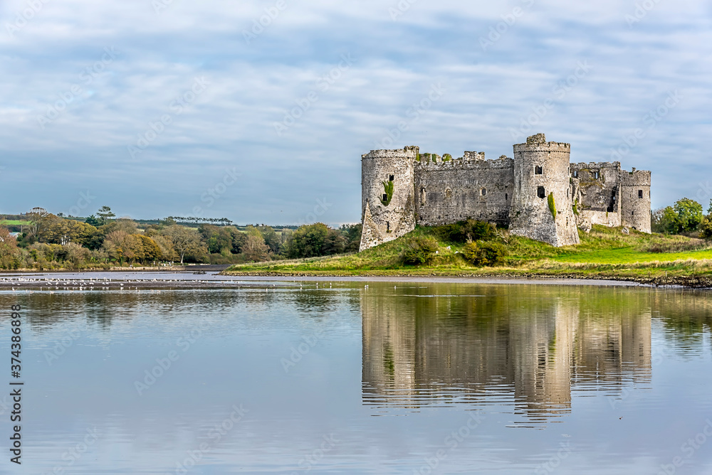 A view of the Carew River, Pembrokeshire and the ruins of the Norman castle