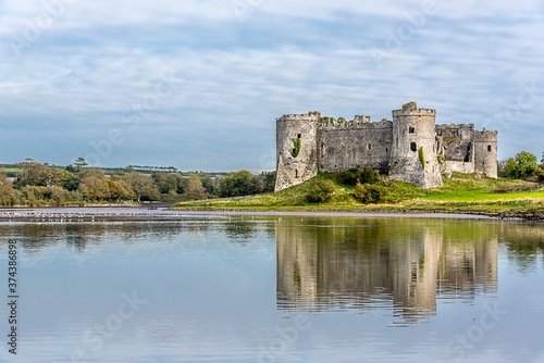 A view of the Carew River  Pembrokeshire and the ruins of the Norman castle