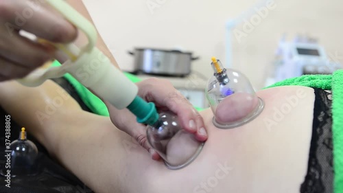 Wallpaper Mural Massage therapist massaging young woman in the spa office. Vacuum massage the body.	
 Torontodigital.ca