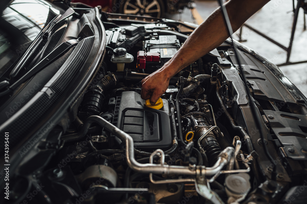 Auto mechanic hands, car technical inspection in service Auto mechanic hands, car technical inspection in service