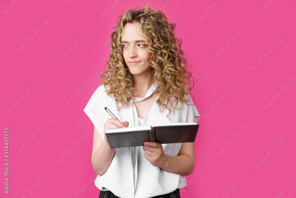 A charming woman makes entries in the diary. A charming woman makes entries in the diary.