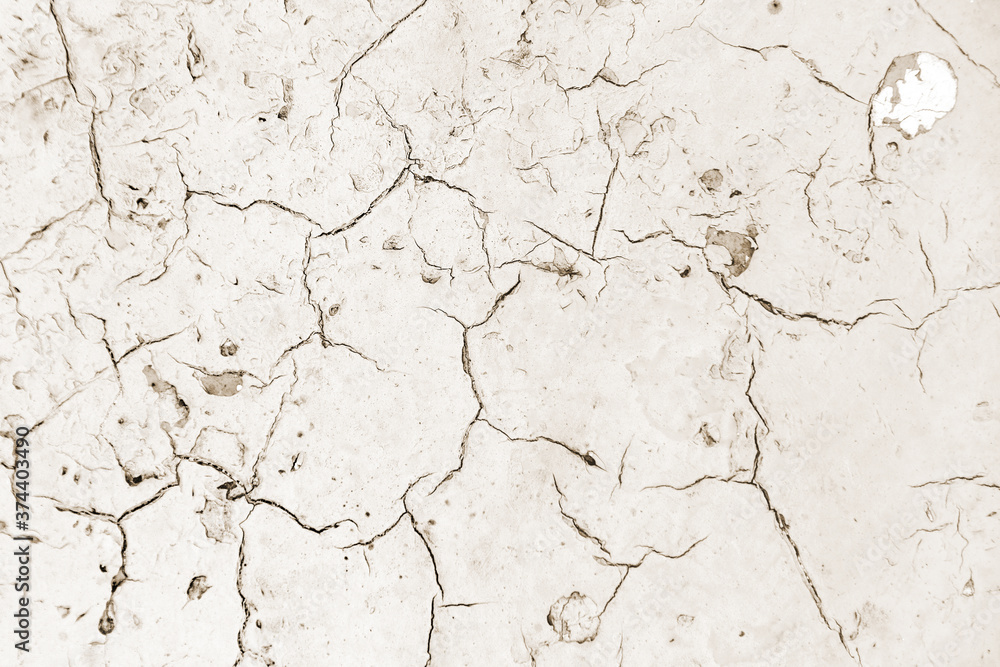 Distressed overlay texture of cracked concrete, stone or asphalt. Grunge background. Abstract illustration