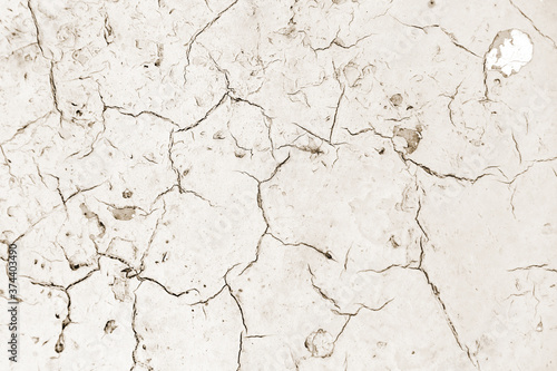 Distressed overlay texture of cracked concrete, stone or asphalt. Grunge background. Abstract illustration