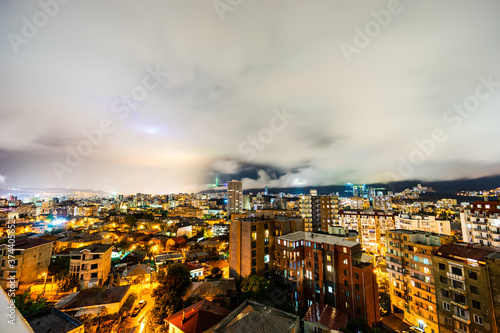 Dramatic night sky over Tbilisi city