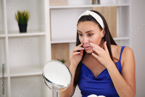 girl does skin care, at home, in a nightgown