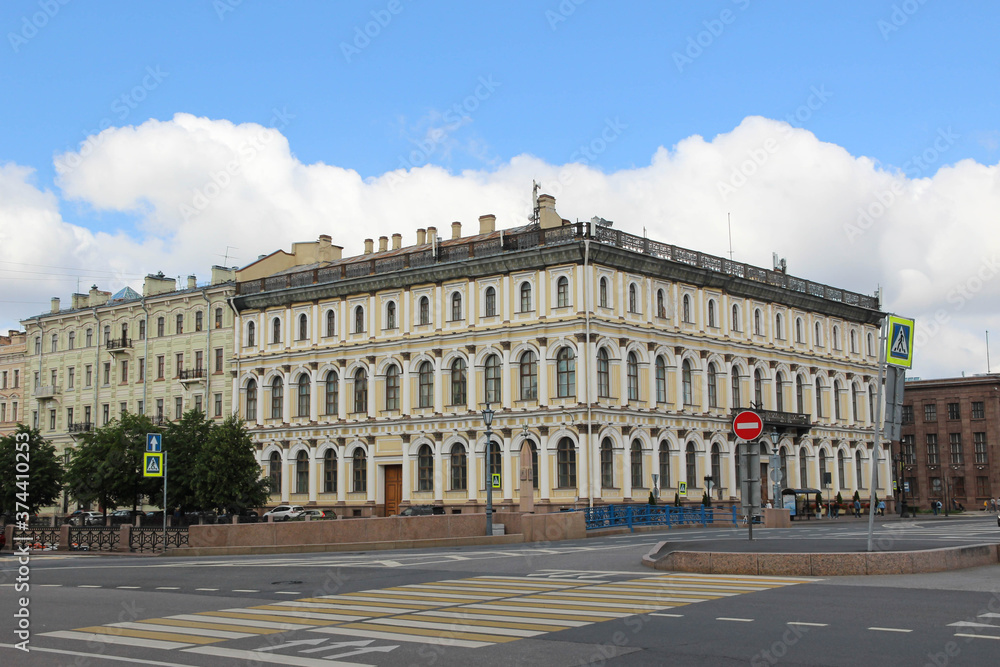 Beautiful light yellow building in St. Petersburg and blue sky.  Crossway. 