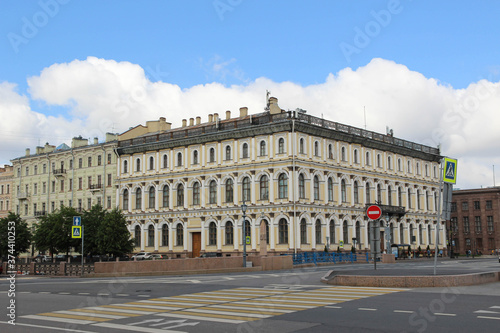 Beautiful light yellow building in St. Petersburg and blue sky. Crossway. 