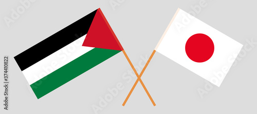 Crossed flags of Palestine and Japan