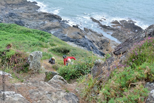 Retired hikers on athe path on the coast of Locquemeau in Brittany. France photo