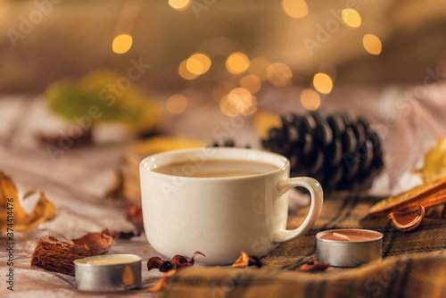 A cup of latte with candle decoration at home, holiday season, autumn, close up, still life photography