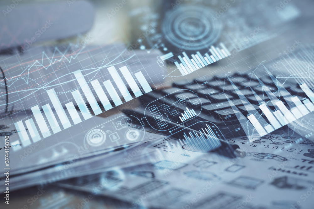 Double exposure of financial chart drawings and desk with open notebook background. Concept of forex market Double exposure of financial chart drawings and desk with open notebook background. Concept of forex market