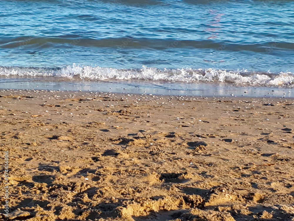 Closeup shot of seascape and sandy beach in Italy