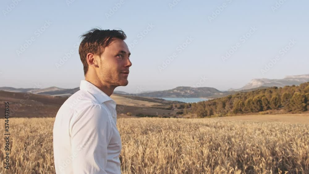 Panoramic Shot of Beautiful Open Wheat Fields and Man Standing in the Middle Panoramic Shot of Beautiful Open Wheat Fields and Man Standing in the Middle