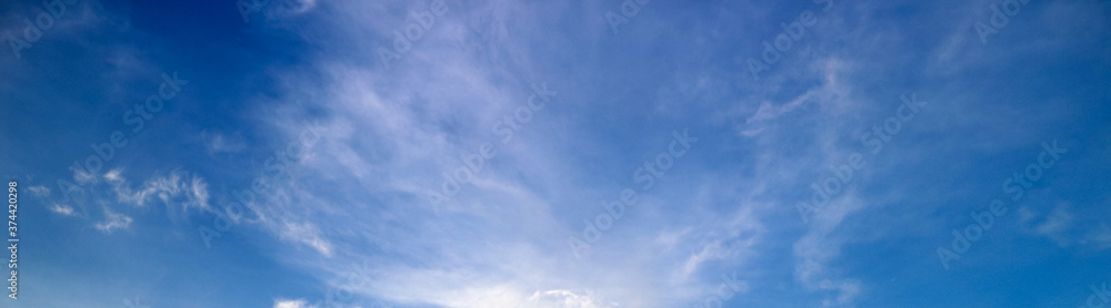 blue sky background with tiny clouds 