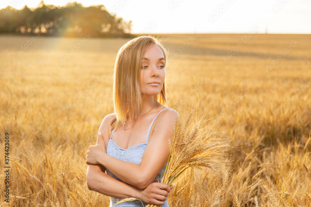 woman in wheat field at sunset woman in wheat field at sunset