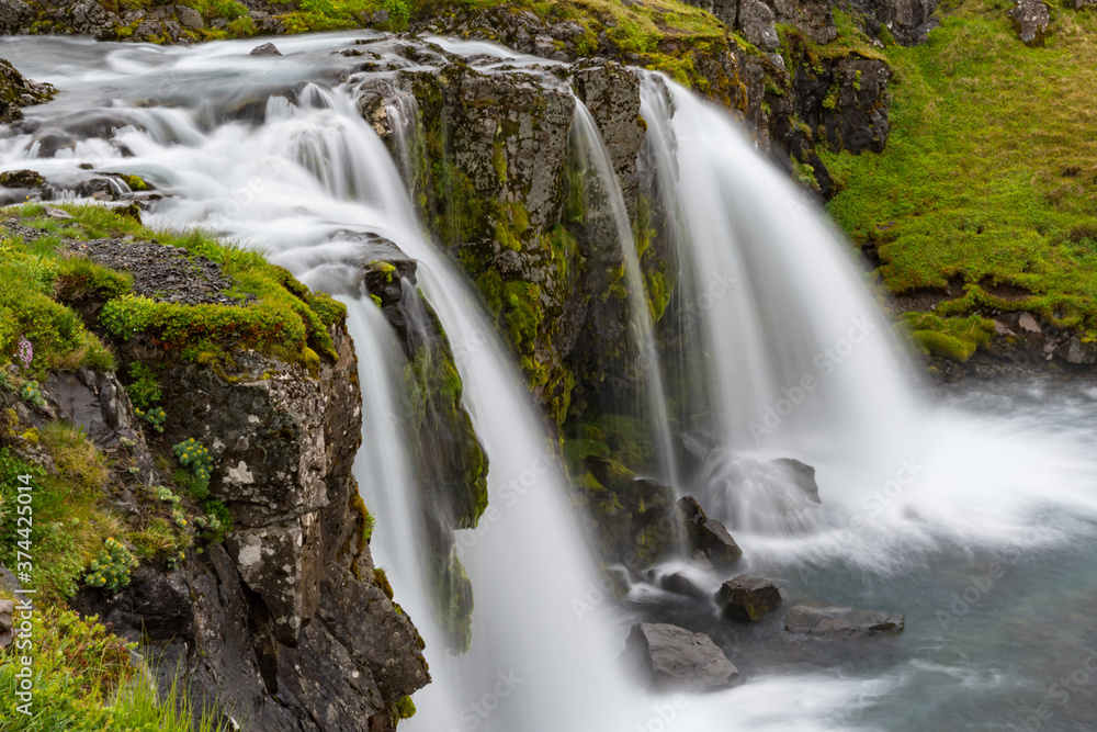 Kirkjufellsfoss waterfall in Snaefellsnes peninsula in Iceland Kirkjufellsfoss waterfall in Snaefellsnes peninsula in Iceland
