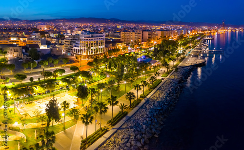 Island of Cyprus. Panorama of evening Limassol. View of Limassol from a drone. The Limassol promenade is lit by evening lights. The Mediterranean coast in the dark. Evening in Cyprus. photo