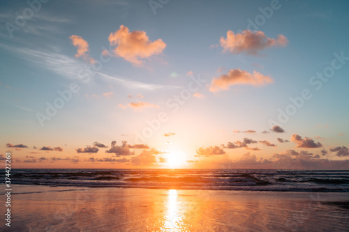 Beach with bokeh orange sunset theme color.