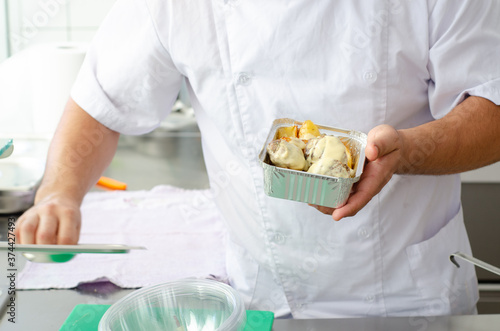 person holding a food pack of water