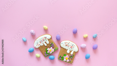 Easter poster and banner template with Easter cakes and colored eggs on pink background.Greetings and presents for Easter Day in flat lay styling.Promotion and shopping template for Easter