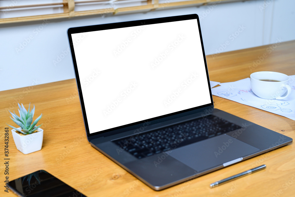 Blank screen laptop computer on wood table with clipping path. business concept. Mockup with space. Blank screen laptop computer on wood table with clipping path. business concept. Mockup with space.