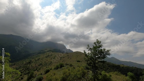 Time lapse clouds over the mountains. Clouds on the top of mountain Khustup, Syunik province, Armenia.Mountain in fog. Khustup mountain near Kapan city. photo