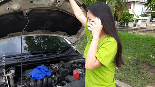 woman with broken car