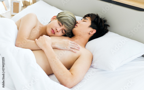Homosexual men or gay couples lying on the bed.