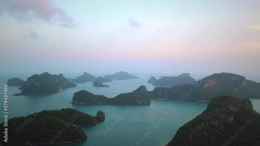 Thailand's seascape islets bokeh: woman looking on greenery isles in National Marine Park Moo Koh Ang Thong. Epic Thai attraction for tourists vacation. Footage cinematic shot in 4K, UHD