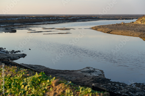 Wooden fence on a field / Sunset on the beach / sunset over the river