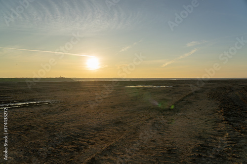 Wooden fence on a field / Sunset on the beach / sunset over the river