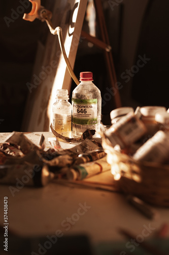 brushes in a glass for oil painting in the artist's studio