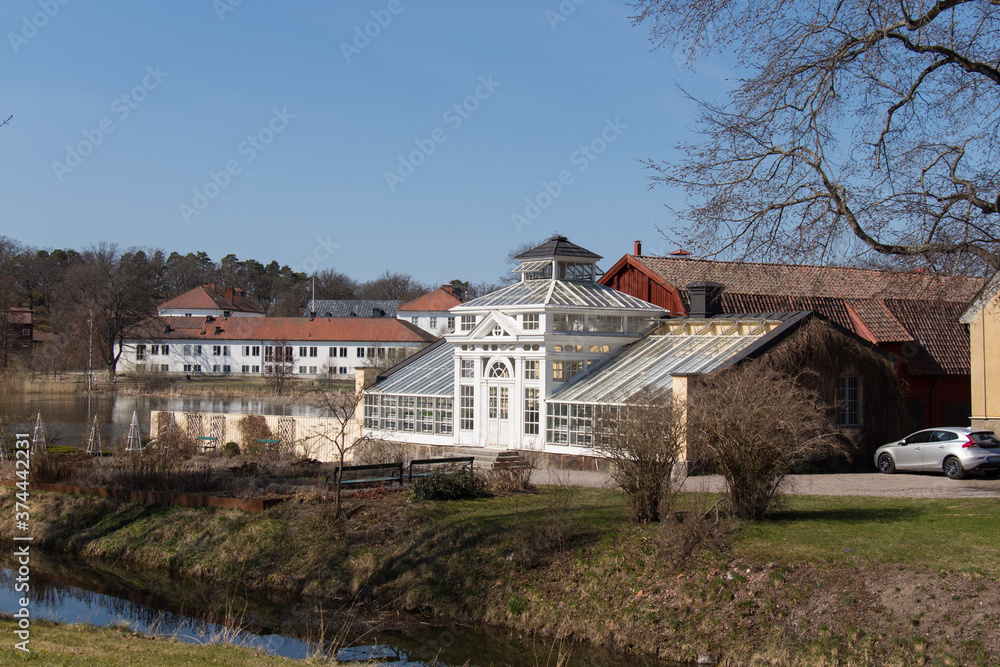 Mariefred, Sweden - April 20 2019: the view of white building of orangery at Gripsholm Castle territory on April 20 2019 in Mariefred, Sweden.