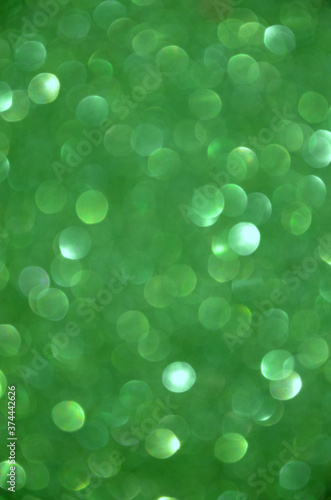 Blurred shiny green background for card design.Concept and color of Saint Patricks Day.