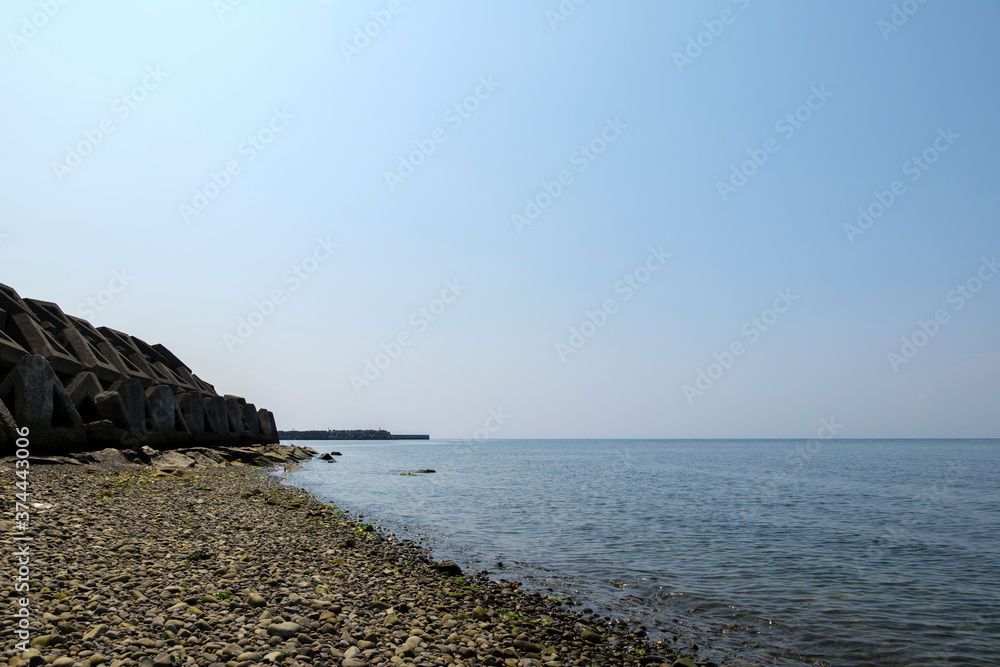 A view of the beach on a clear day in mid-summer A view of the beach on a clear day in mid-summer