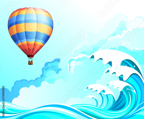 Hot air balloon flying over high ocean waves set against a cloudy blue sky