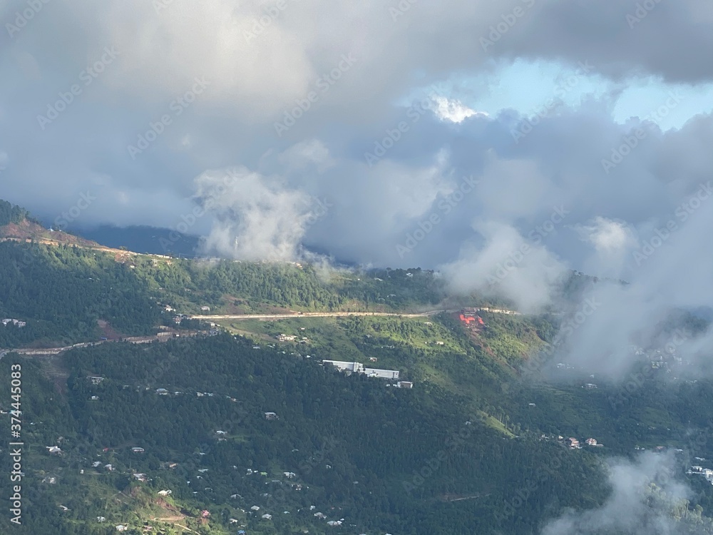 view of clouds over hills