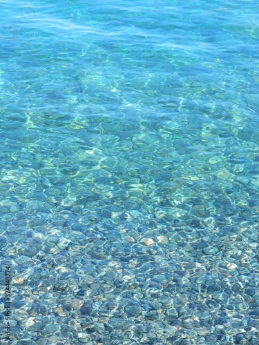 crystal clear turquoise blue water. azure coast. stone under crystal water