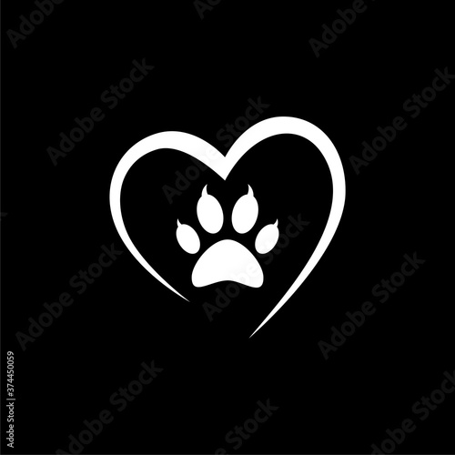 Heart with animals footprint icon isolated on dark background