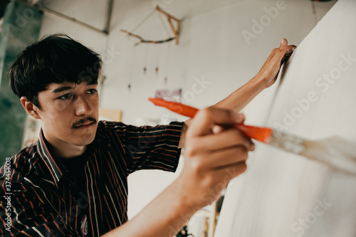 moustache artist preparing canvas for drawing